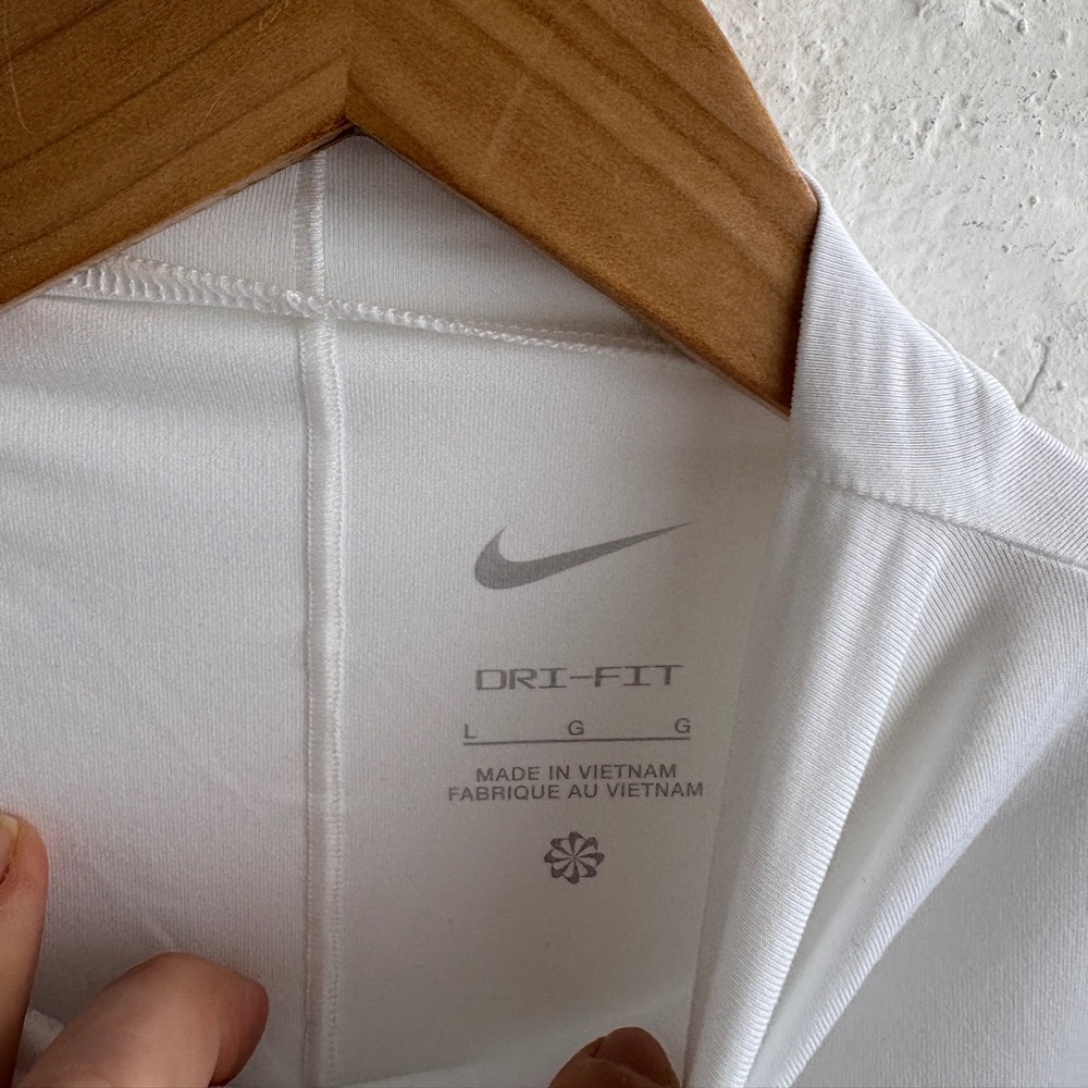 white Nike Dri-FIT One Luxe
Women's Long-Sleeve Cropped Top - Picture 9 of 12
